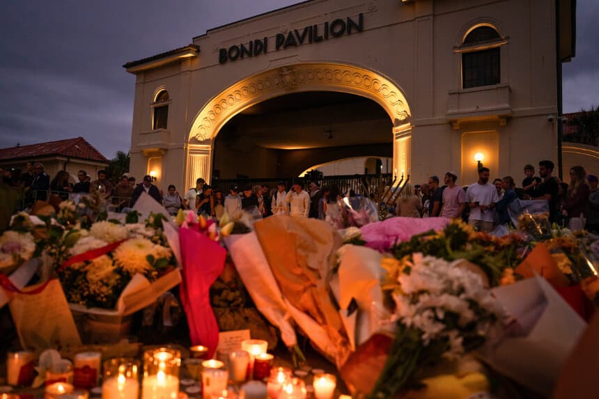 SYDNEY, AUSTRALIA - DECEMBER 16: Floral tributes and candles are placed at at Bondi Pavilion at Bondi Beach on December 16, 2025 in Sydney, Australia. Police say at least 15 people and one suspected gunman were killed and more than a dozen others injured when two attackers opened fire near a Hanukkah celebration at the world-famous Bondi Beach, in what authorities have declared a terrorist incident. The government is moving to tighten gun laws across the country. (Photo by Audrey Richardson/Getty Images)
